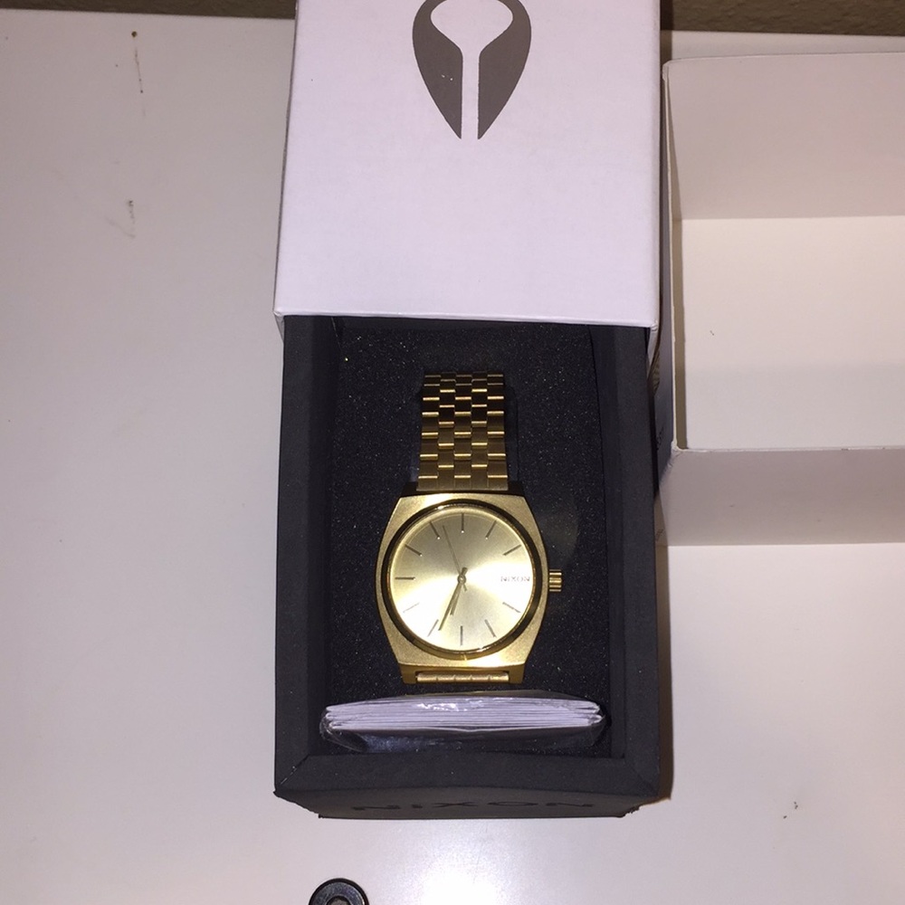 All gold Nixon watch